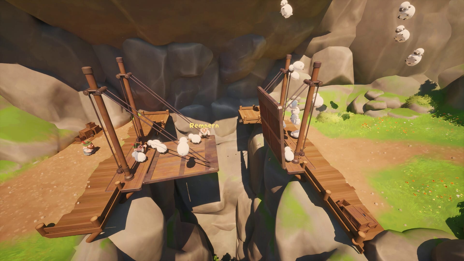 Looking down into a rocky chasm crossed by a wooden drawbridge, with sheep crossing it and more sheep falling past the cliff.